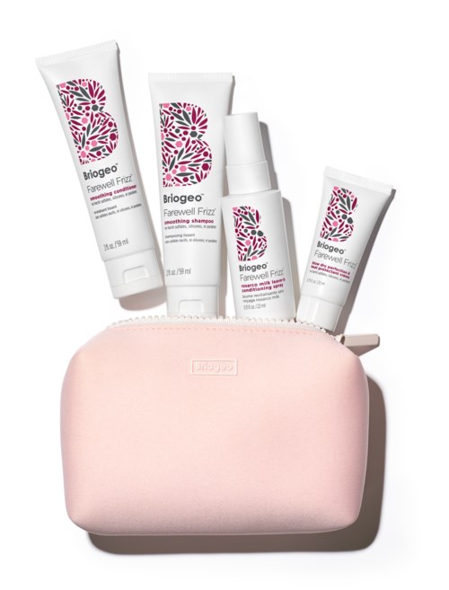 Four skincare tubes emerge from a pink pouch or bag. The tubes have white backgrounds with pink and black designs.