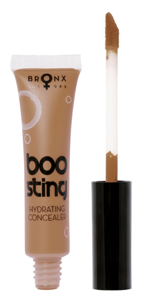 En tub med concealer med applikator, märkt 'Boo Stingo,' avsedd för att återfukta och täcka hudfläckar.