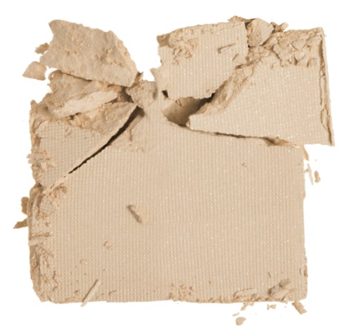 Ett stort brutet stycke av beige material, kanske kartong eller lera, med ojämna kanter och mindre fragment.