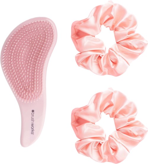 A pink scalp brush with soft bristles and two pink satin scrunchies.