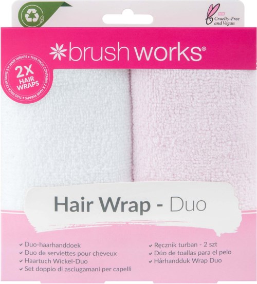 Pink und weißes Haarband-Duo-Verpackung mit Text und Recycling-Symbol, zeigt cruelty-free und vegan, geeignet für Frisuren.