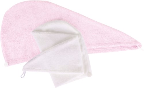 Zwei Stoffstücke, eines rosa und eines weiß, sind gefaltet und übereinandergelegt. Sie scheinen weich zu sein.