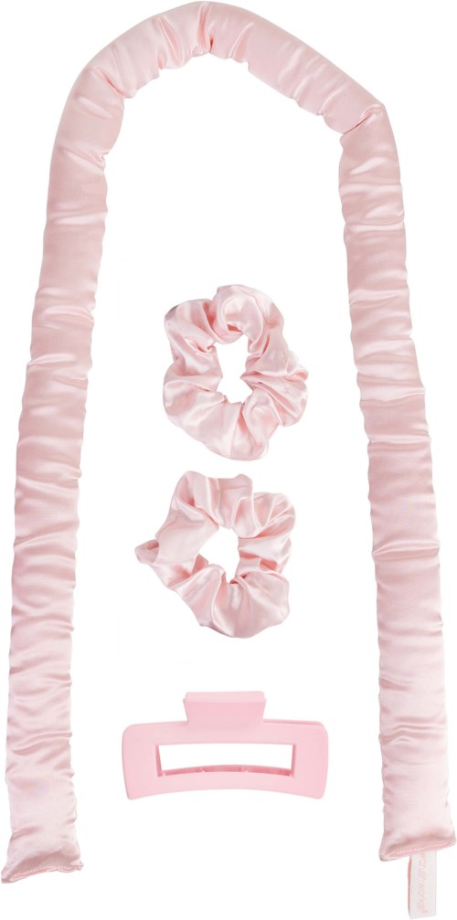 Pink satin hair accessories with scrunchies, a headband, and a hair clip arranged neatly.