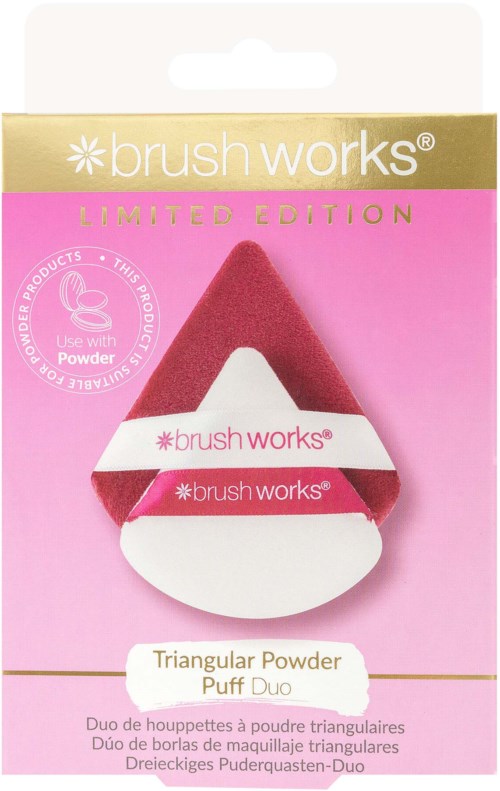 A triangular pink makeup sponge with white and pink bands, in packaging labeled 'brush works' and 'Limited Edition'.