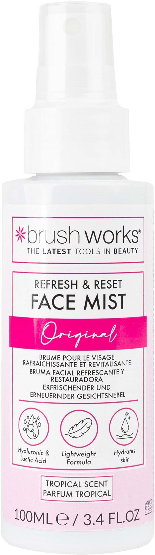 En vit sprayflaska med rosa etikett, som läser 'Brush Works Face Mist', för huduppfriskning med tropisk doft.