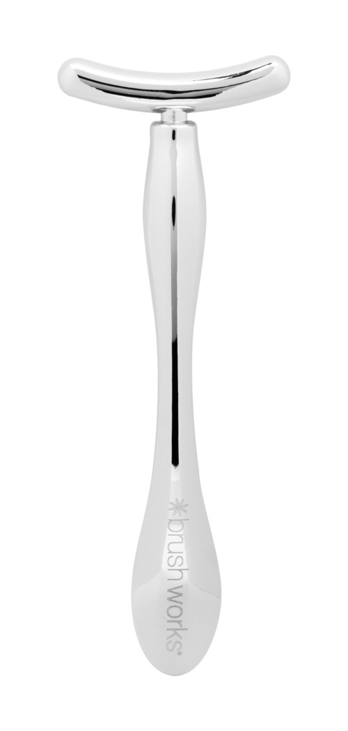 A sleek, silver facial massager with a curved top for skin treatment.