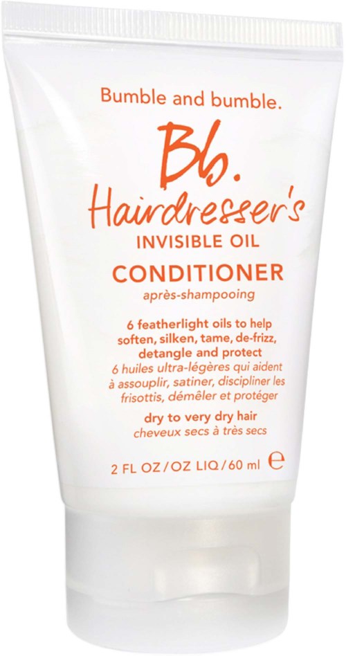 En vit tub med Bumble and bumble balsam med orange text för mycket torrt hår.