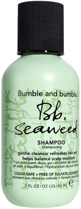 Jasnobrązowa butelka szamponu z czarnym korkiem, oznaczona 'Bumble and Bumble Seaweed Shampoo,' dla skóry głowy i włosów.