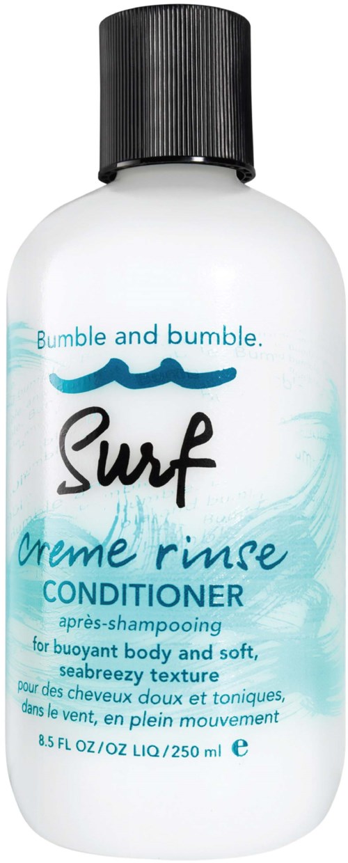 En hvit flaske med svart lokk, merket Surf Creme Rinse Conditioner for middels hår, sjøbris duft, 8,5 fl oz.