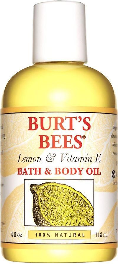 En liten flaska Burt's Bees citron- och vitamin E bad- och kroppsolja med en citronbild och naturlig etikett.
