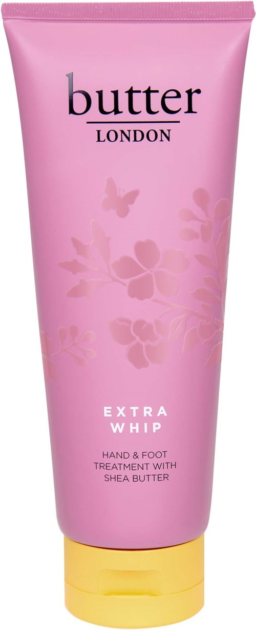 Rosa hand- och fotkrämstub med blommor och en fjäril, märkt 'butter London Extra Whip.'