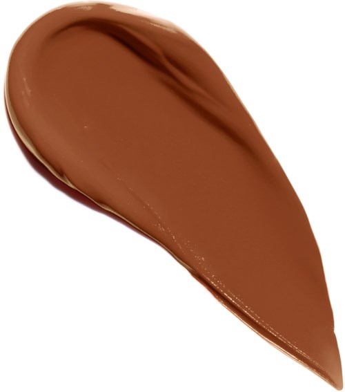 En liten ström av brun krämig substans, troligtvis choklad eller smink, på en vit bakgrund.