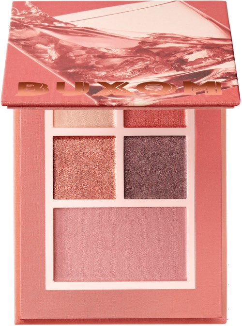En rosa sminkpalett med fyra olika blush och ögonskuggfärger, delvis täckt av ett glänsande marmormönstrat lock.