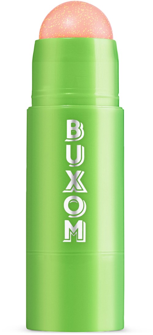 A green BUXOM lip balm container with a pink balm inside. The brand name is on the container.