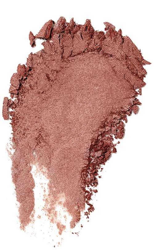 A swatch of pinkish powder pigment, spread unevenly with rough edges and textured surface.