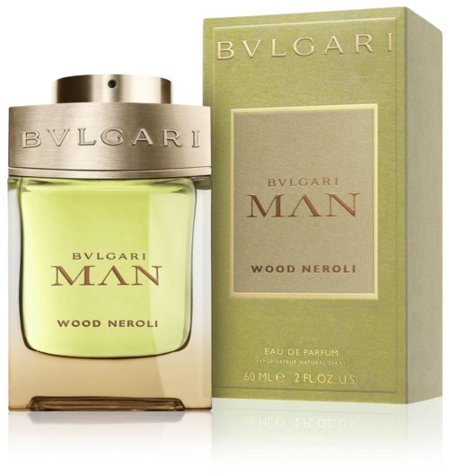 En Bvlgari Man Wood Neroli parfymflaska och box, båda i gröna nyanser, med silver- och brunt text.