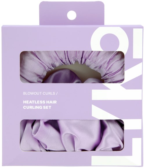Lila förpackning med två synliga locktänger inuti. Texten säger "Heatless Hair Curling Set" och "Blowout Curls."
