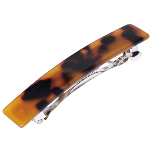 A hair clip with a tortoise shell pattern in yellow and brown colors.