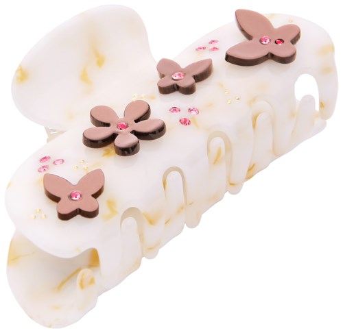 A white cake decorated with pink butterfly shapes and pink small stones on top.
