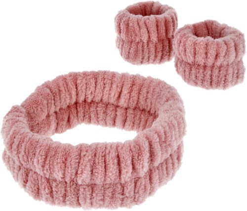 Een set van drie roze, pluizige, gebreide haarbanden, met één groter band en twee kleinere.