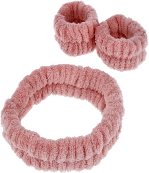 Een set roze, pluizige haaraccessoires: een hoofdband en twee haarbandjes.