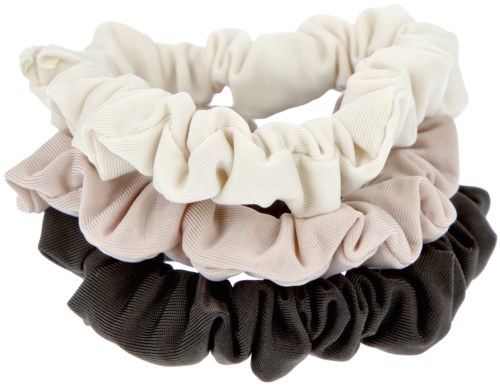 Tre tygband i vitt, beige och svart staplade tillsammans.