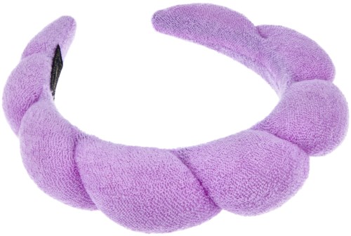 A soft, purple, plush headband with bunny ears and a pom-pom decoration.