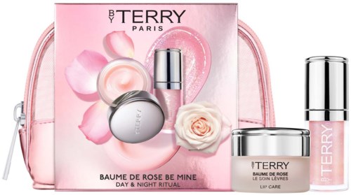 Pink beauty gift set with creams, lipstick, and a rose, in a soft pink bag. Designed for lip care and skincare.