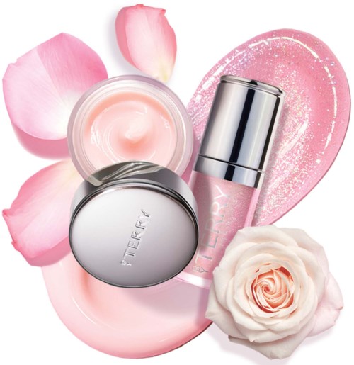 Beauty products with pink cream, a rose, and flower petals on a pink background.