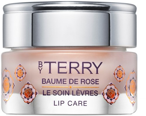 Liten krukke med leppepomade, dekorert med blomster og lilla tekst, merket "Terry" og "Lip Care."