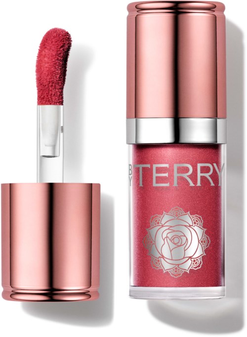 Lip gloss with a pink shade and a rose logo on the packaging. Cap removed, showing the applicator.