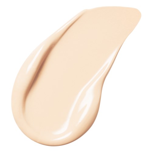 En dråpe av beigefarget kremaktig væske, sannsynligvis foundation eller lotion, med glatt, glansfull tekstur.