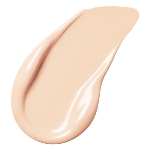 En beige-farget flytende foundation eller krem med glatt, glansfull tekstur formet som en tåre.