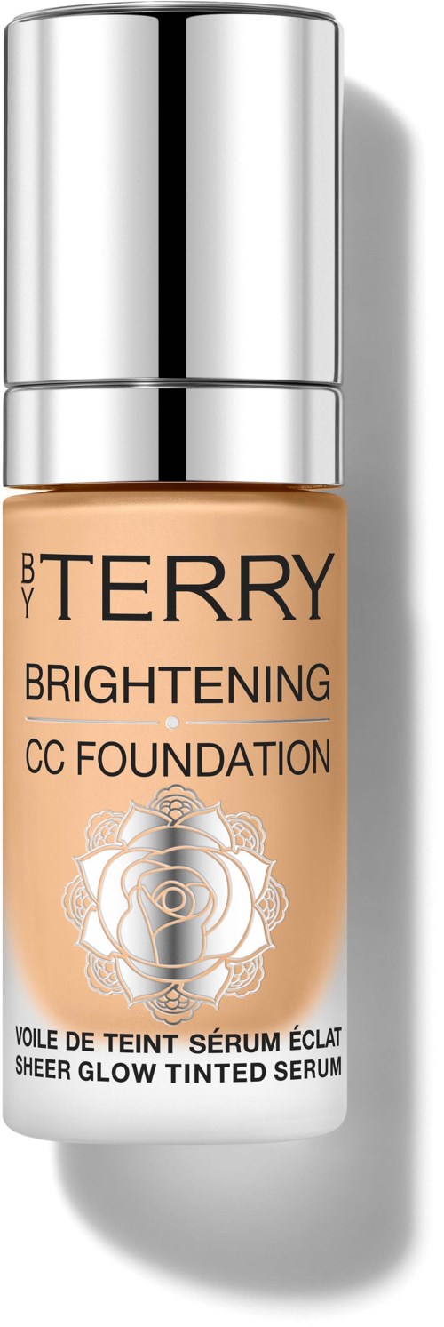 En flaske av BB By Terry Brightening CC Foundation med en sølvhette og et rosedesign på etiketten.