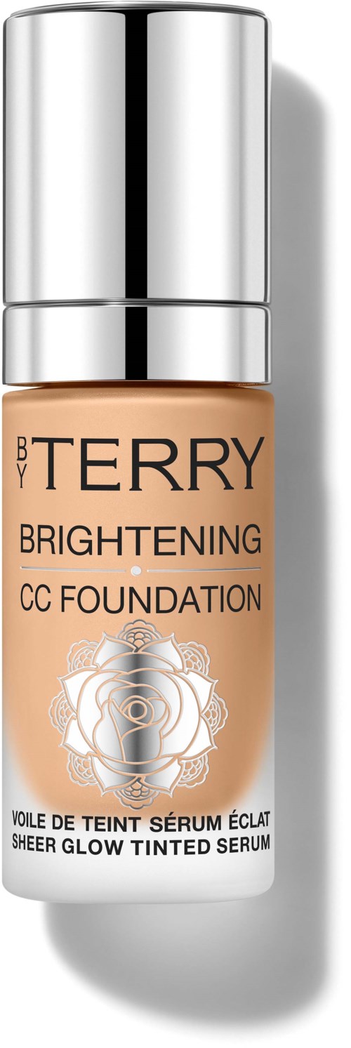 En flaske med BY TERRY Brightening CC Foundation med sølvhette og rosedesign på etiketten.
