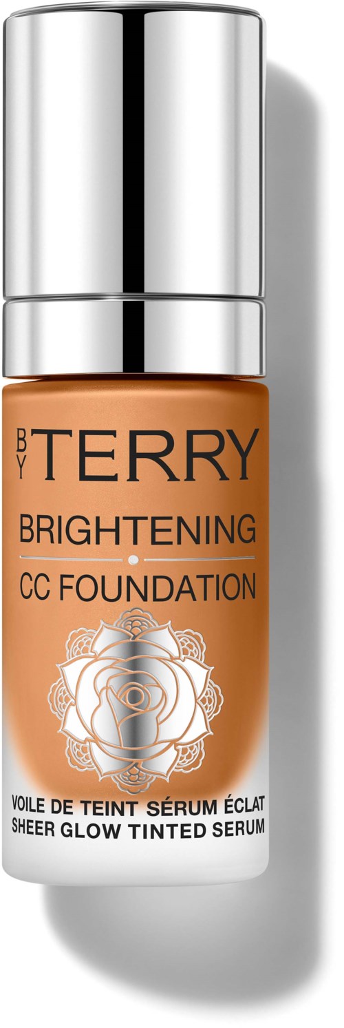 En flaske med BY TERRY Brightening CC Foundation med sølvlokk og hvit og ORANSJE etikett.