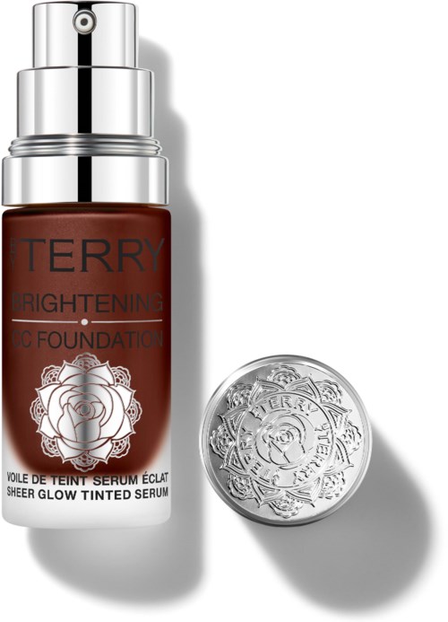 En brun flaske med Terry Brightening BB Foundation med sølvpumpe og separat sølvlokk.