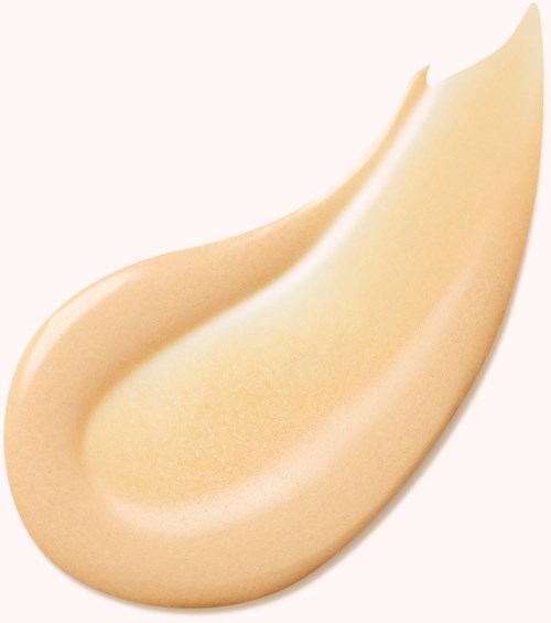 Cream-colored beauty blender with a teardrop shape, smooth surface, and rounded edges.