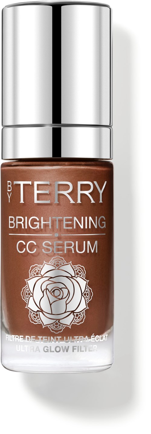 En liten flaske med brunt CC-serum med sølvlokk og en etikett med en rose og merke. 
