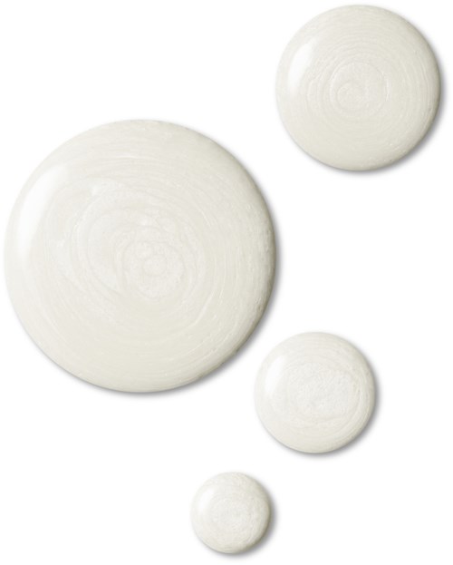 Four white ceramic bowls of different sizes with a glossy finish on a white background.