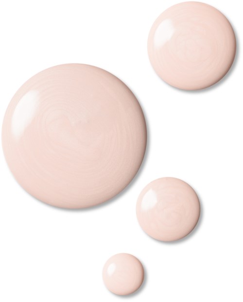 Fyra mjuka rosa sfärer i olika storlekar på en vit bakgrund, slät och glänsande yta.