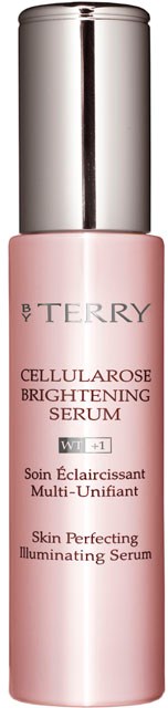 En rosa, cylindrisk flaska med silverlock, märkt BY TERRY cellullose lystergivande serum.