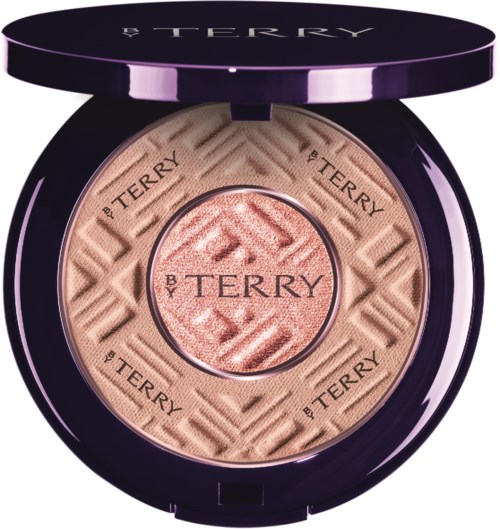 A compact case holds a light pink pressed powder with the brand name 'By Terry' engraved around the edges.