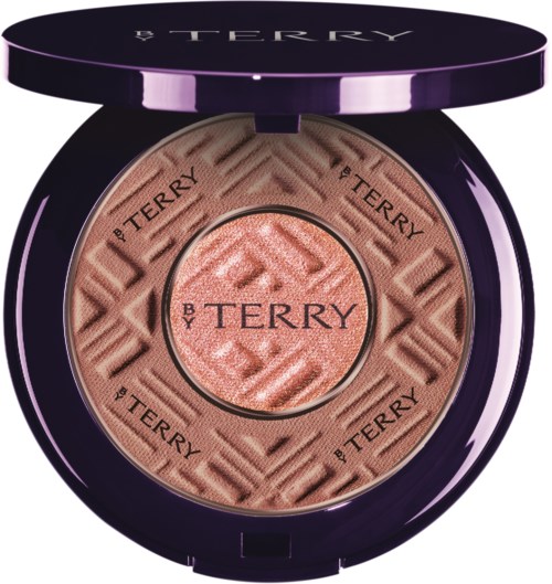 A compact with blush and a purple lid featuring the B. TERRY logo, branded around the edges. The blush has a textured pattern.