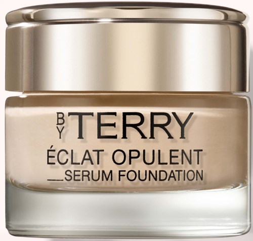 En burk med By Terry Éclat Opulent Serum Foundation med guldfärgat lock och svart textetikett.