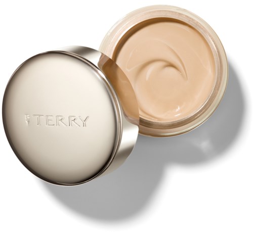 En rund, silver lock till lock med orden "TERRY" på, öppen för att visa beigekräm inuti.