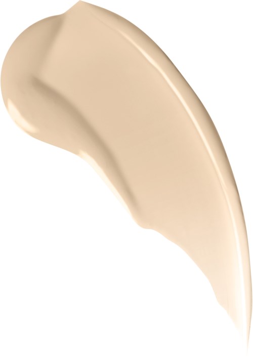 En virvel av beige eller lysbrun foundation eller krem på hvit bakgrunn.
