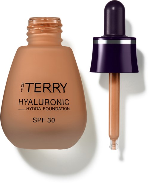 En beige foundationflaske med dråpe, merket 'BY TERRY Hyaluronic SPF 30'.