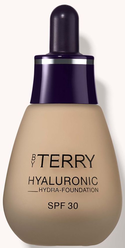 En beige foundationflaska med en lila pipettlock, märkt 'BY TERRY HYALURONIC HYDRA-FOUNDATION SPF 30'.