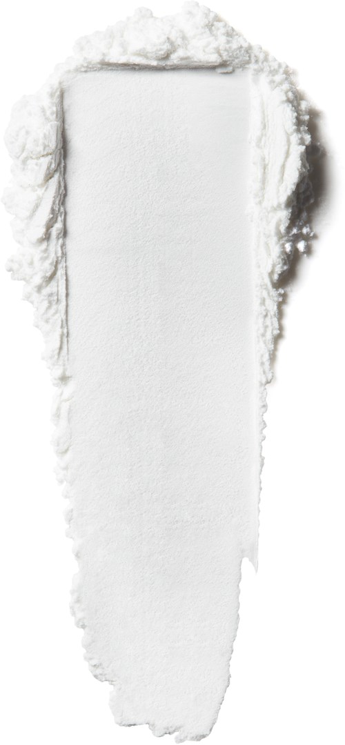 A white, textured powder is spread out in a narrow, vertical strip with rough edges. The background is dark.